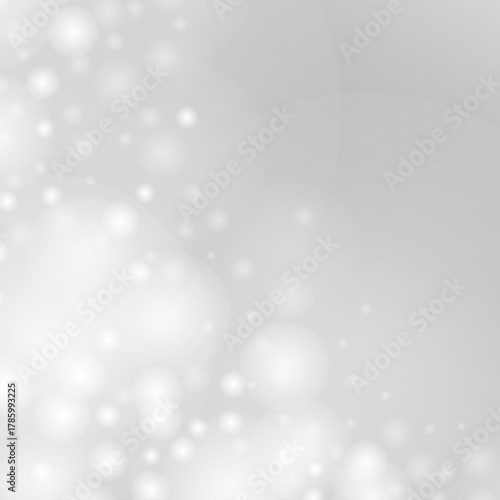 優しく包み込む光が舞う幻想的で穏やかな雰囲気のモノクログラデーション背景