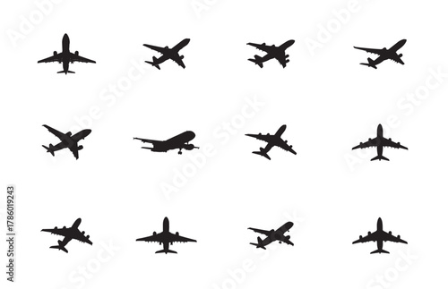 Collection of airplane silhouettes in various positions on a white background