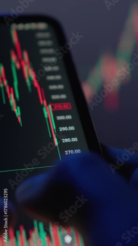A closeup image shows hands gripping a smartphone displaying important stock market data, highlighting the vibrant trading dynamics and easy access to market analysis on digital platforms