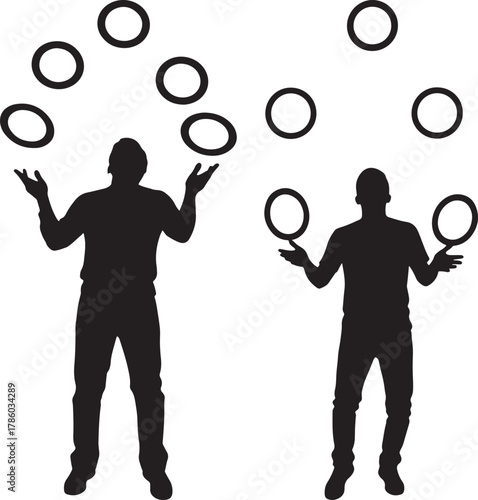 Two people juggling rings in silhouette