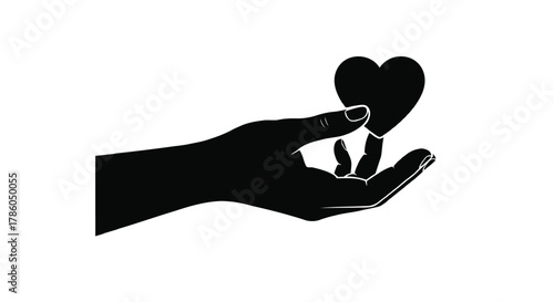 Silhouette of a hand gently holding a black heart shape against a clean white background symbolizing love and care