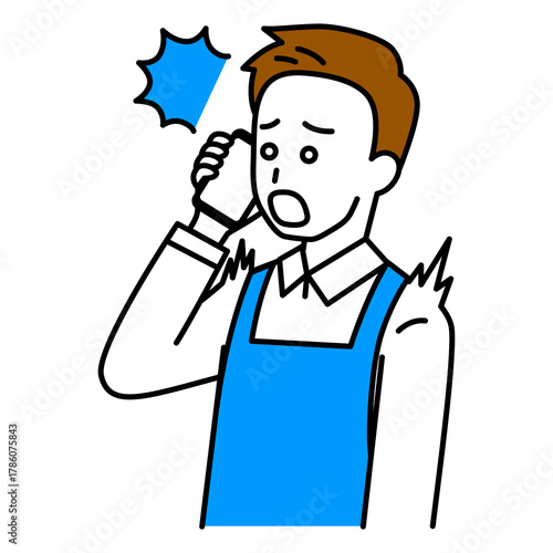 スマートフォンでの通話で驚くエプロン姿の男性