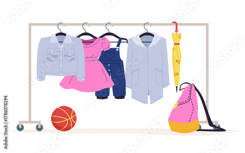 Kids’ denim jacket, pink dress, overalls, raincoat, umbrella, backpack, and basketball displayed on clothing rack, isolated on white background vector illustration