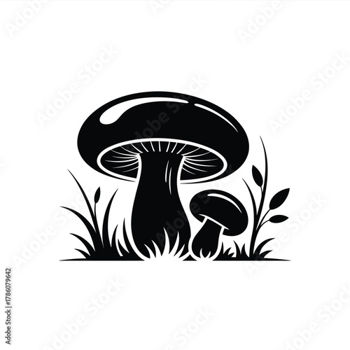 Black and white illustration of two mushrooms in grass