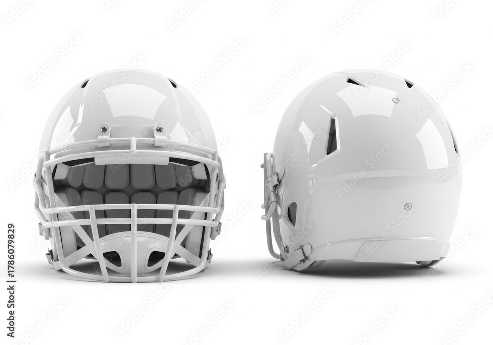 Fototapeta premium Two white american football helmets displayed on a white background