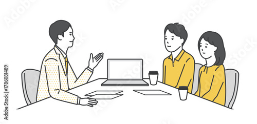 窓口でお客様の接客をするビジネスパーソン