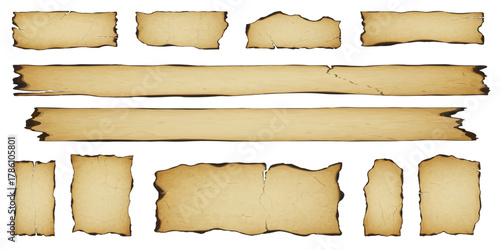 A collection of old, tattered parchment paper pieces and banners with burnt edges, isolated on a white background.