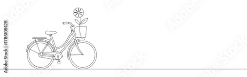 Continuous one line drawing of a bicycle with a flower in the basket. Concept of cycling, nature and healthy lifestyle
