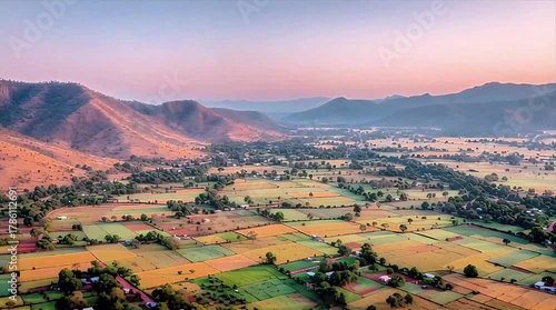 Golden Hour Vistas: Aerial Panorama of Lush Valley and Rolling Hills at Sunset