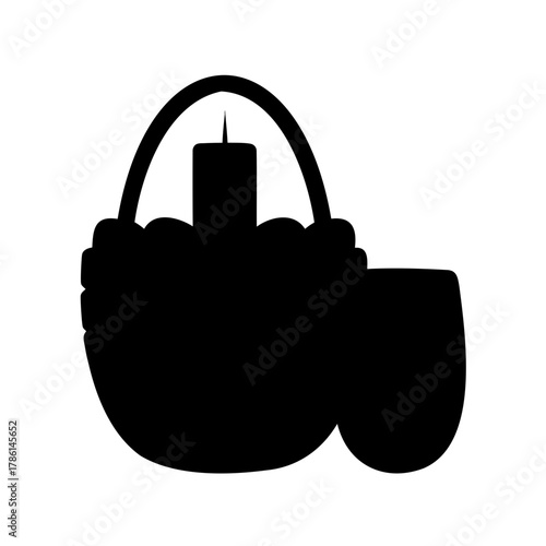 Black silhouette of a traditional Dutch wooden shoe with a candle