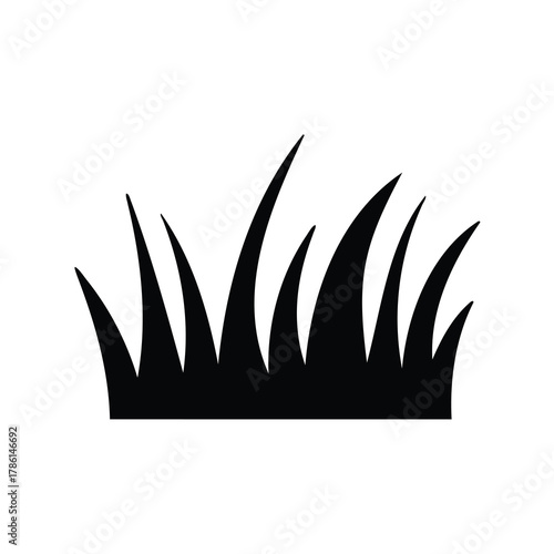A stylized black silhouette of grass blades on a white background