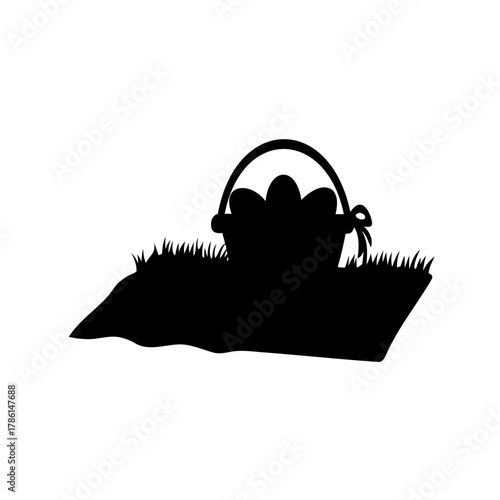 Silhouette of Easter egg basket hiding in the grass on an isolated background