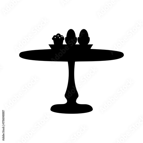 Silhouette image of eggs and a cupcake on a cake stand or table