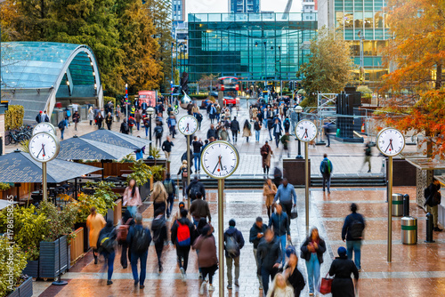 Long exposure view of workers and commuters leaving their offices during rush hour in London at autumn time