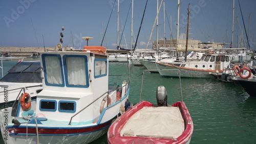 View of boats in Heraklion Venetian Port and Venetian Fortress Rocca a Mare on a sunny day, Heraklion, Crete, Greek Islands, Greece, Europe