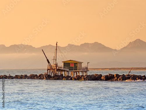 Trebuchet fishing hut at sunset, Marina di Pisa near Livorno, Tuscany, Italy