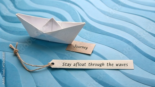 paper boat floating on blue sheet texture  journey concept