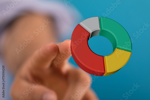 Hand pointing at colorful 3...