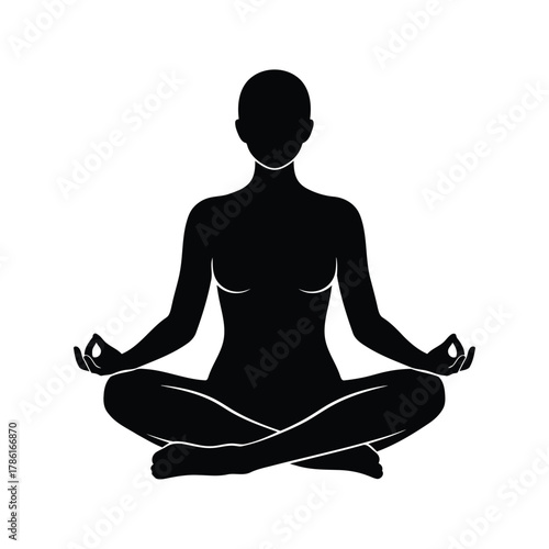 Silhouette of a person meditating in lotus position