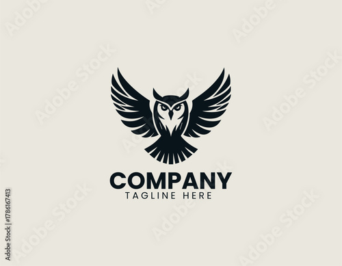 Majestic owl silhouette vector logo illustration with powerful, symmetrically spread wings and detailed feather texture. Wisdom and power concept