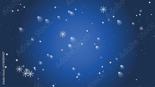 Snowflakes and bubbles falling on a dark blue background in winter season