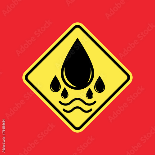 Oil Spill Hazard Sign: A cautionary sign features a black oil drop with smaller drops above water, warning of potential environmental hazards and ecological damage.