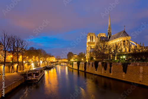 Panoramic view of Notre Dame Cathedral in Paris at night, France