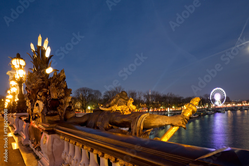 Panoramic view of Pont Alexandre III in Paris at night, France