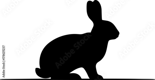 Silhouette of a black rabbit sitting, perfect for logos, design elements, and icons