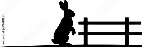Rabbit Silhouette Leaning Against a Wooden Fence on a White Background