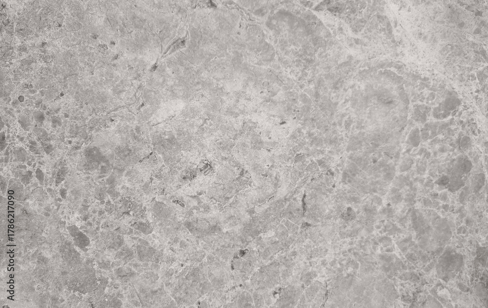 Naklejka premium intricate pattern of natural grey limestone or granite texture. Perfect backdrop for modern, minimalist design, high-end surface modeling, or website banner backgrounds.