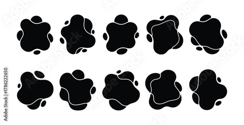 Collection of organic black ink blot shapes on white background