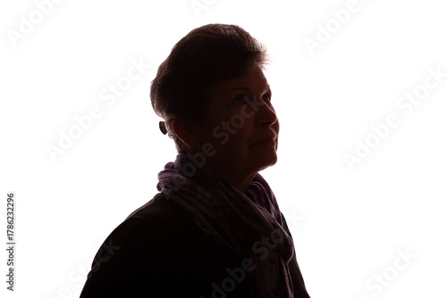 Dark silhouette of an elderly woman, pensioner, curly hair - isolate