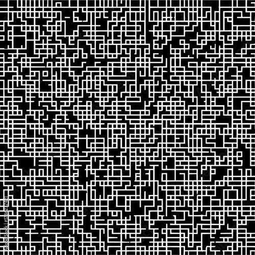 Complex network of interconnected white lines forming a maze like pattern on a black background view