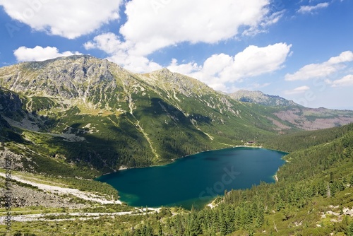 Fototapeta Naklejka Na Ścianę i Meble -  View of the mountain lake Morskie Oko and Opalony Wierch in the Rybiego Potoka Valley, Polskie Tatry. Poland. Europe.