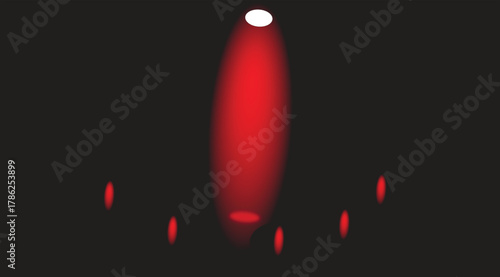 The prominent red spotlight positioned at the top center of the image creates a focal point, casting a vibrant beam of light downwards.