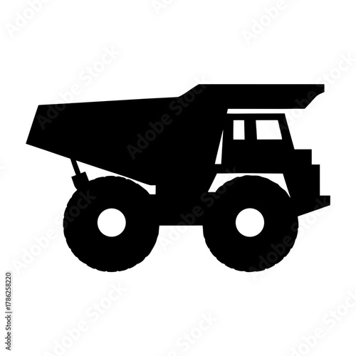 Large mining dump truck in black silhouette