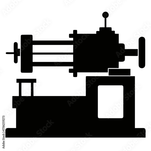 Industrial lathe machine in a stark black silhouette