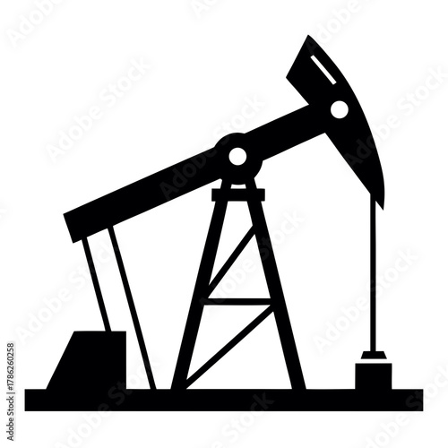 Industrial oil pump jack in silhouette silhouette