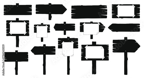 A collection of wooden signposts with blank white paper attached, set against a white background.