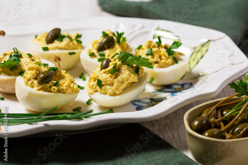 Eggs stuffed with mousse of egg yolk, mayonnaise, mustard and capers.