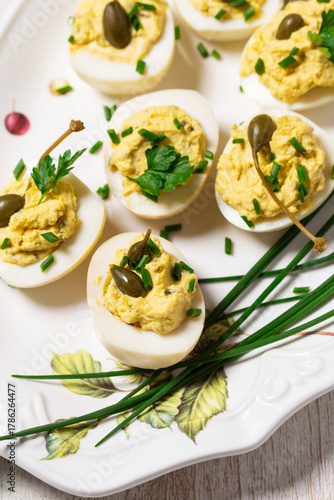 Eggs stuffed with mousse of egg yolk, mayonnaise, mustard and capers.