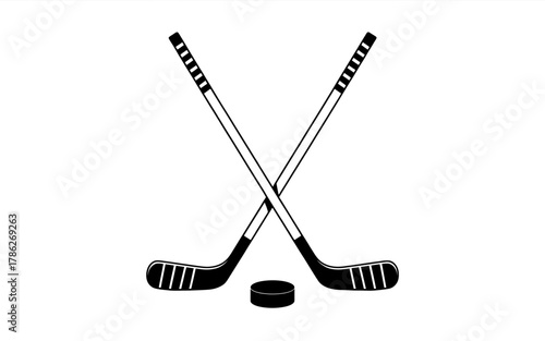 Hockey Sticks and Puck Icon Symbolizing Winter Sports and Team Competition in Black and White Graphic Design Element
