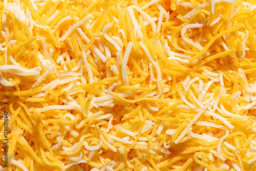 Close up macro of grated shredded cheese blend of Colby and Monterey jack cheeses