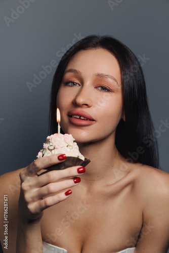 Beauty portrait of a pretty girl with a cake 