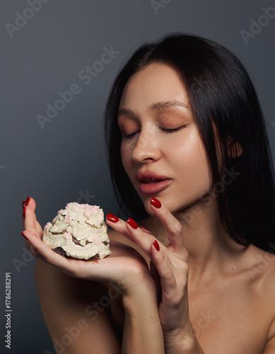 Beauty portrait of a pretty girl with a cake 