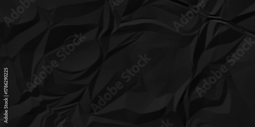 Dark black page wrinkle cardboard crumpled satin fabric ripped cloth decoration background	
