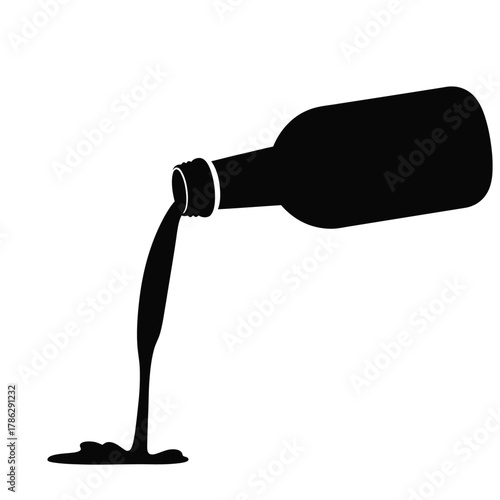 Black bottle pouring liquid onto white background spill