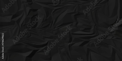Dark black page wrinkle cardboard crumpled satin fabric ripped cloth decoration background	
