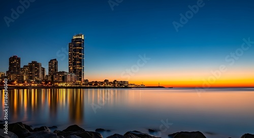 Skyline of mumbai city at dusk with lights reflecting on the water